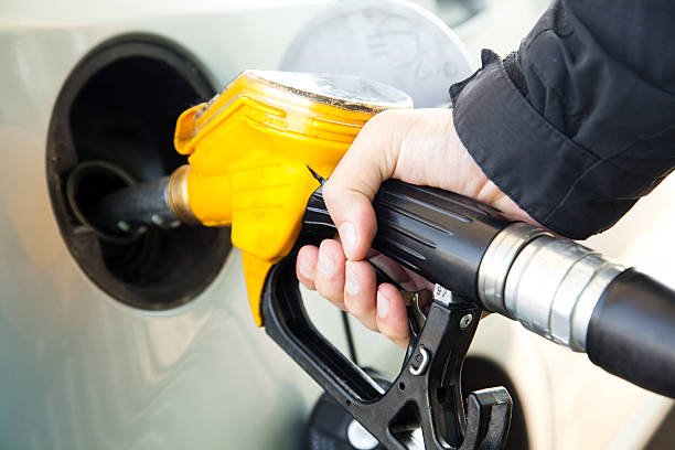 A man pumping diesel in to the tank